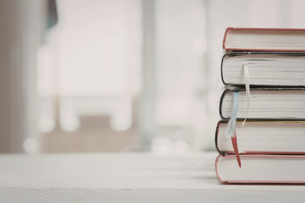 Accompanying picture for the introduction to SG Rehab Articles library. Featuring a small stack of books.