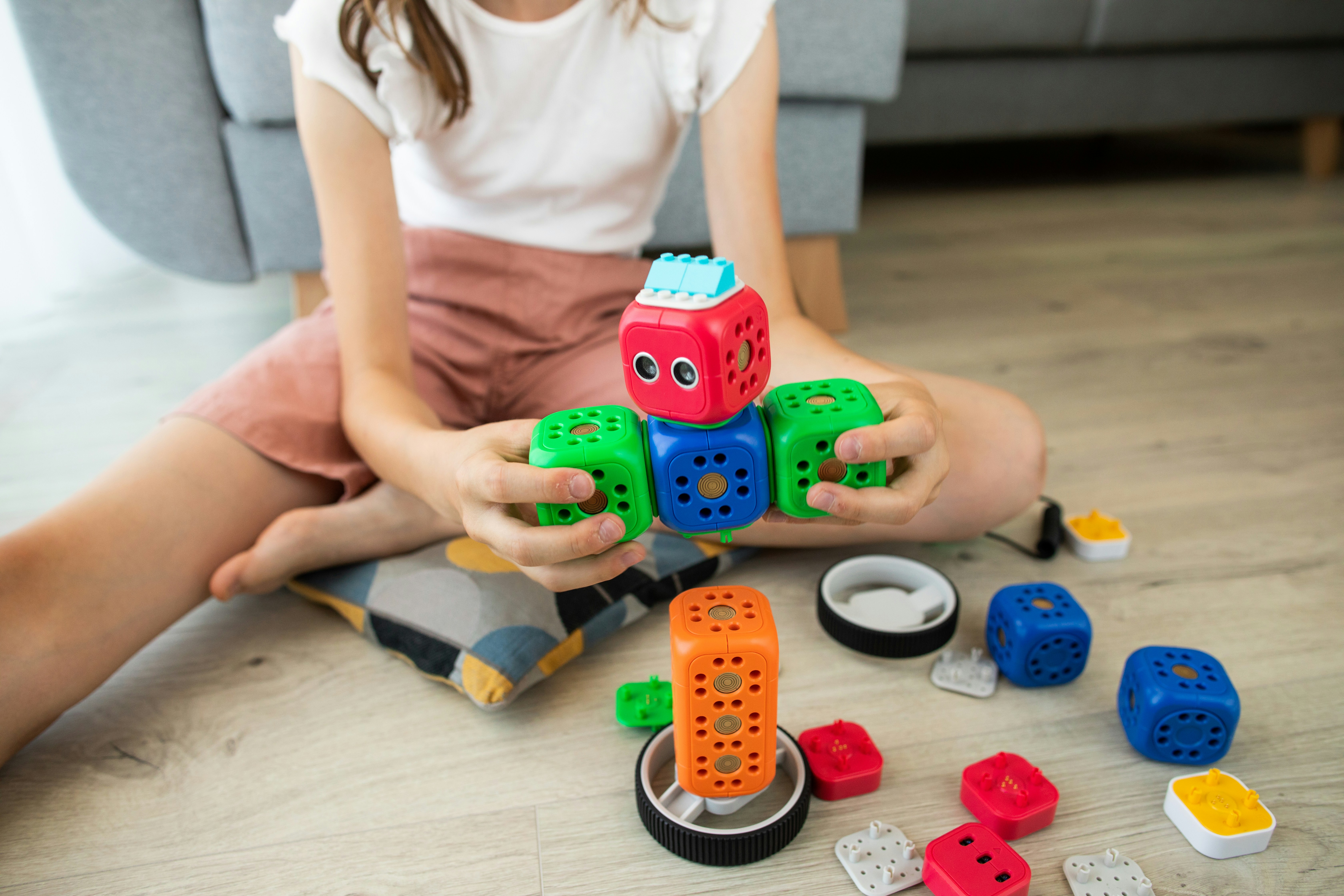 Image of young girl playing with a robot game
