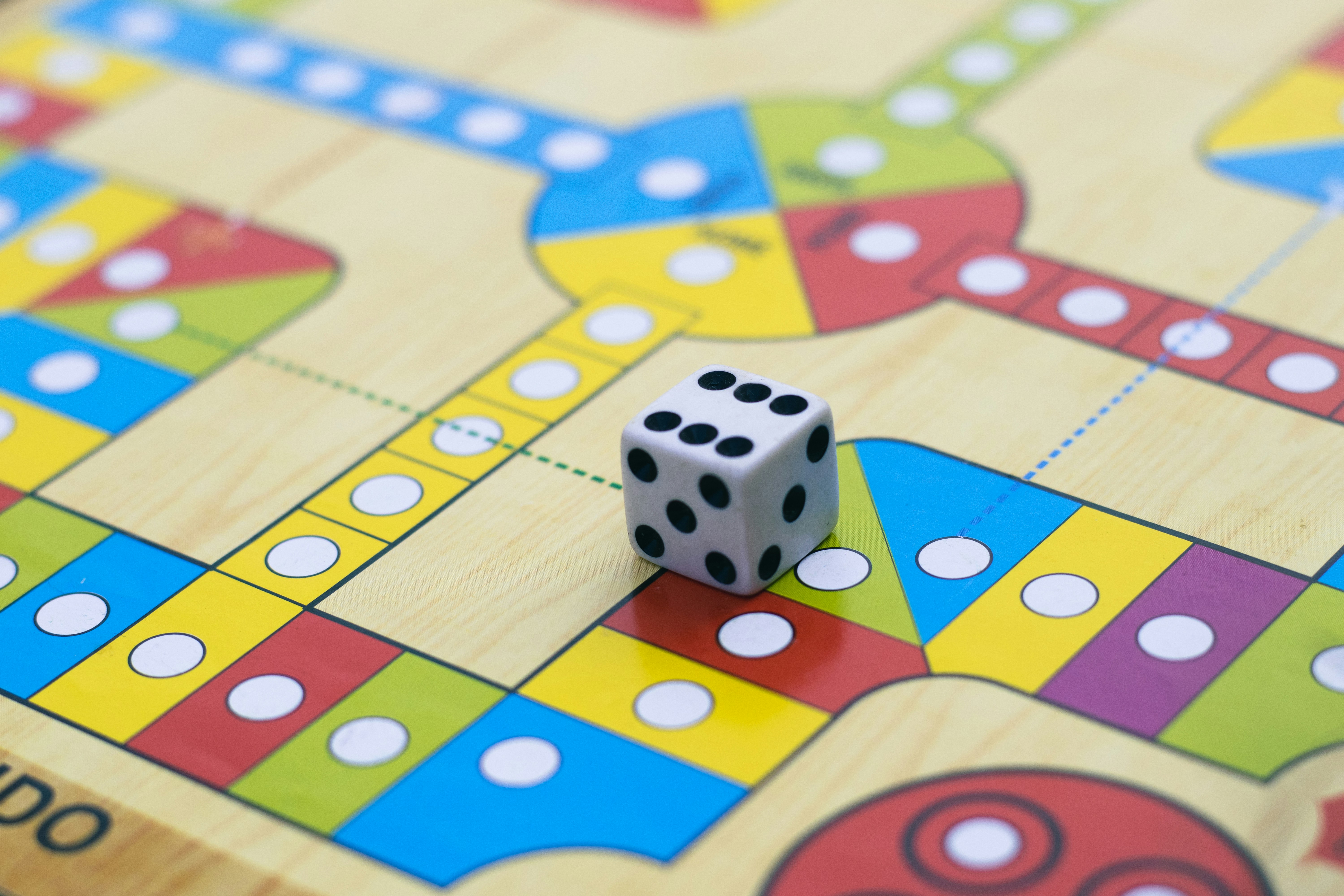 Close up of a board game with a six-sided dice